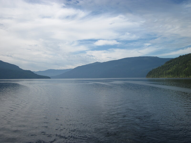 Calm Lake Surrounded by Mountains