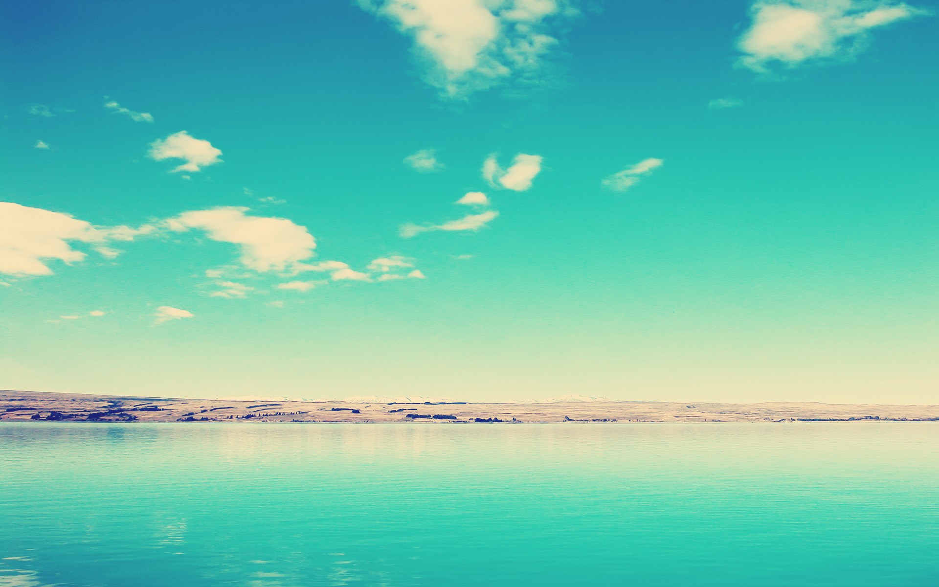 calm lake under blue sky