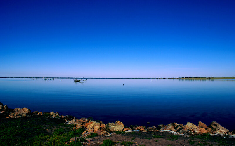 Calm lake under clear sky