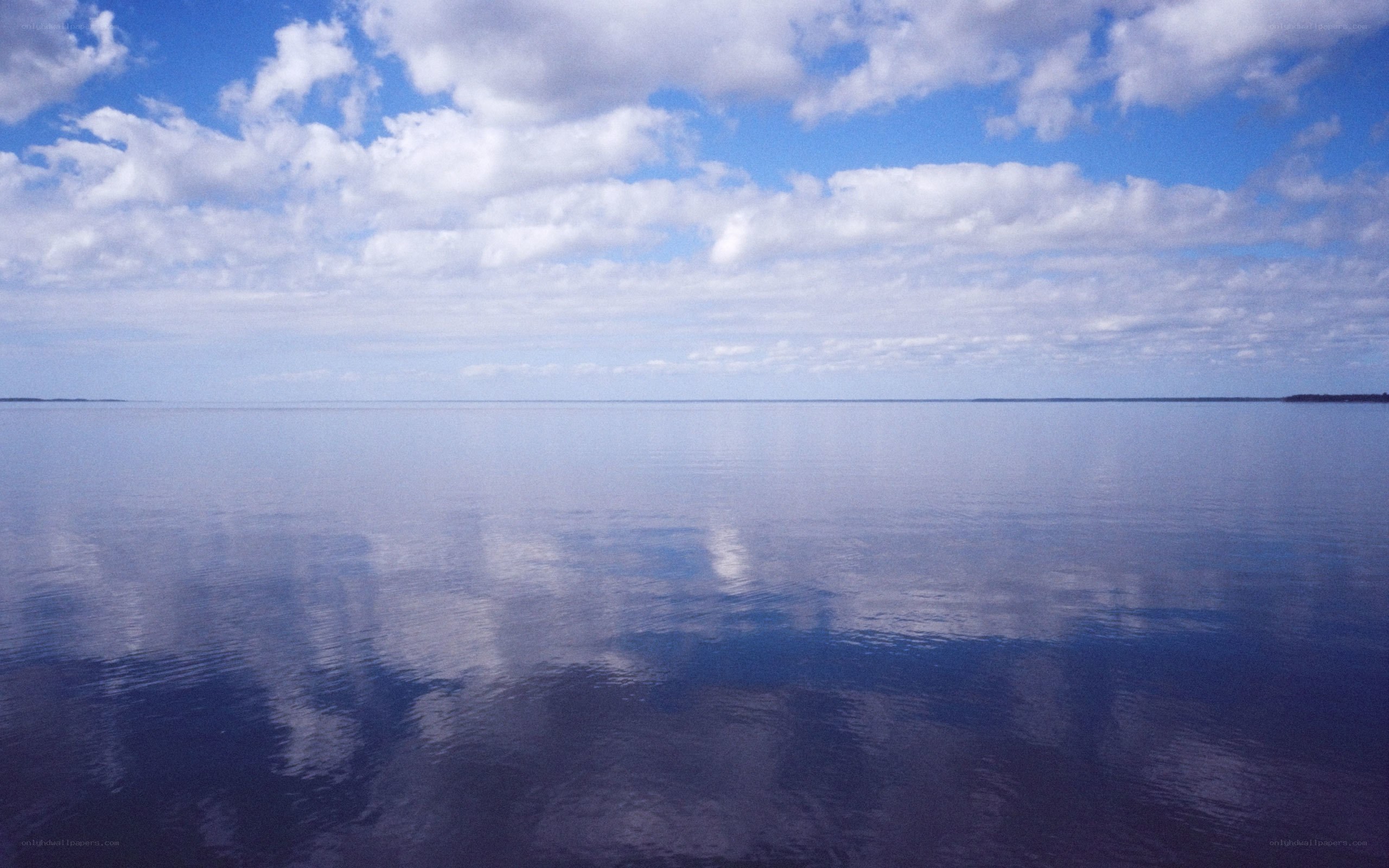 calm lake under cloudy sky
