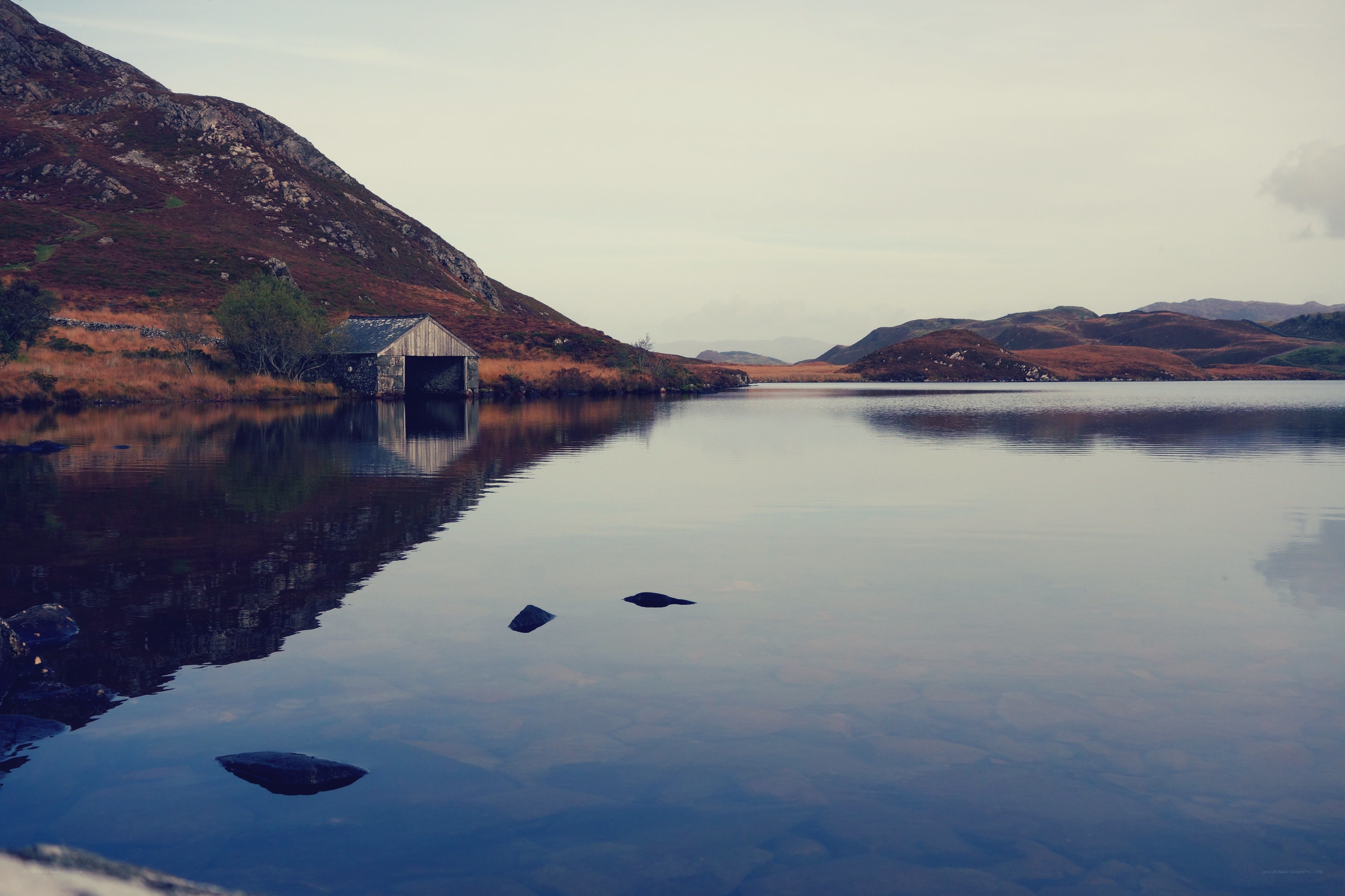 Calm lake with boathouse
