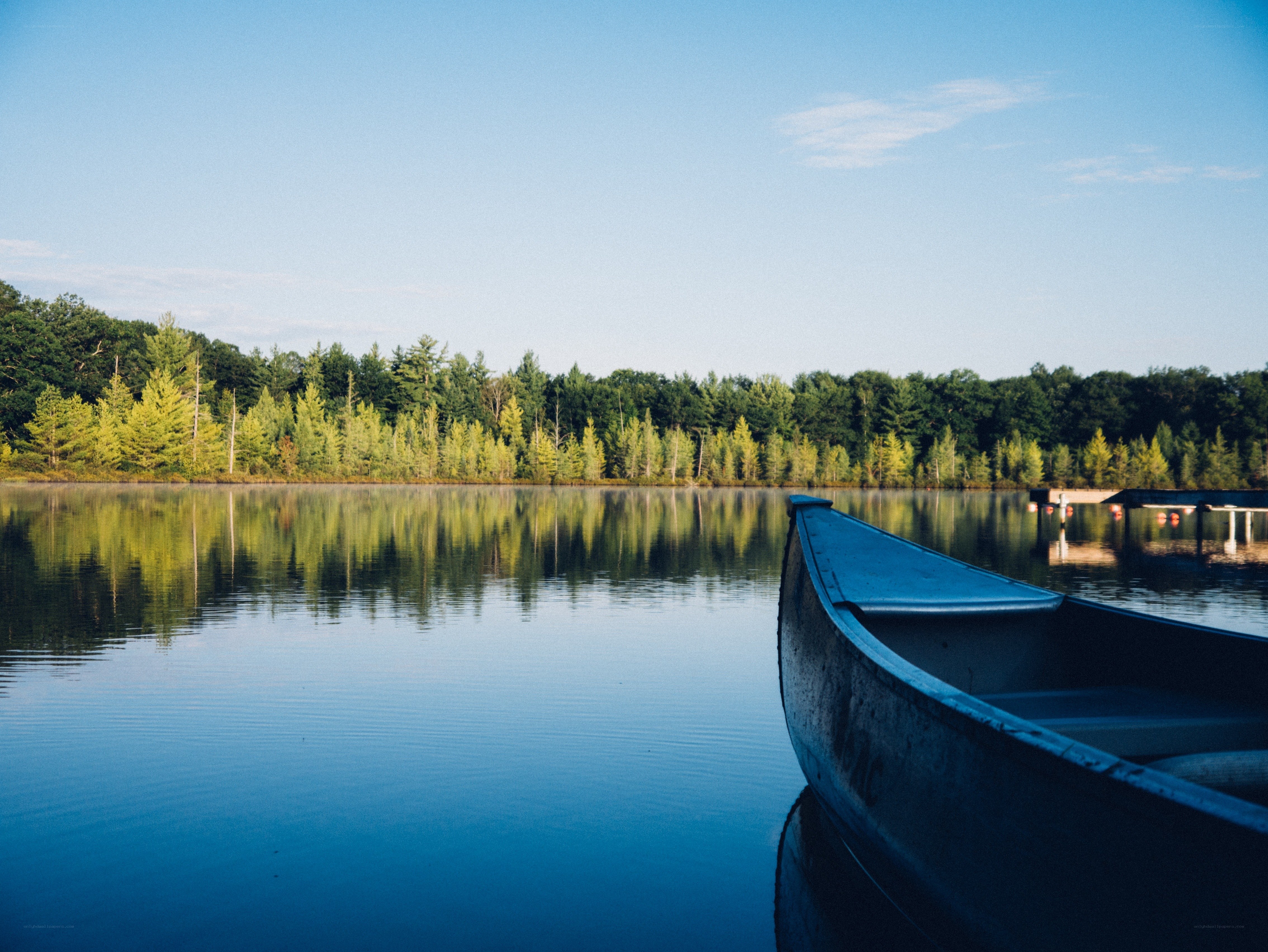 Calm lake with canoe