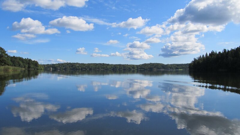 Calm lake with cloud reflections