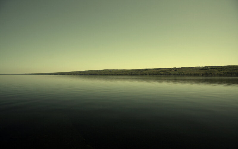 calm lake with distant hills