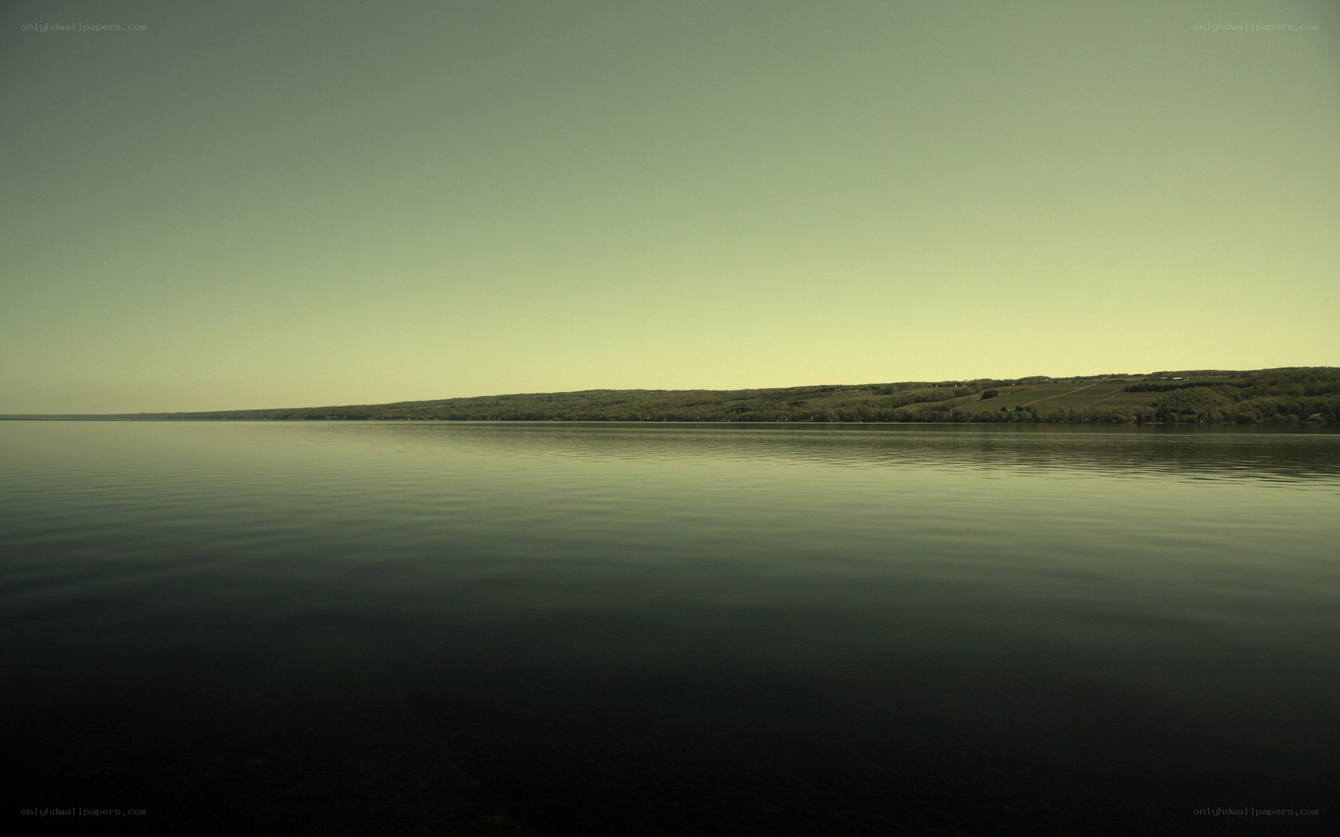 calm lake with distant hills