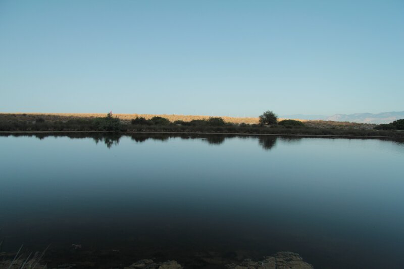 calm lake with distant hills
