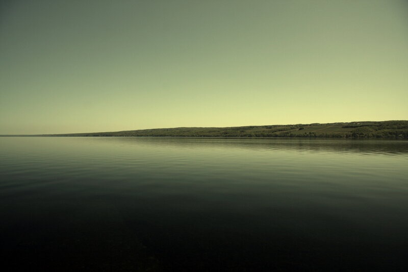 calm lake with distant hills