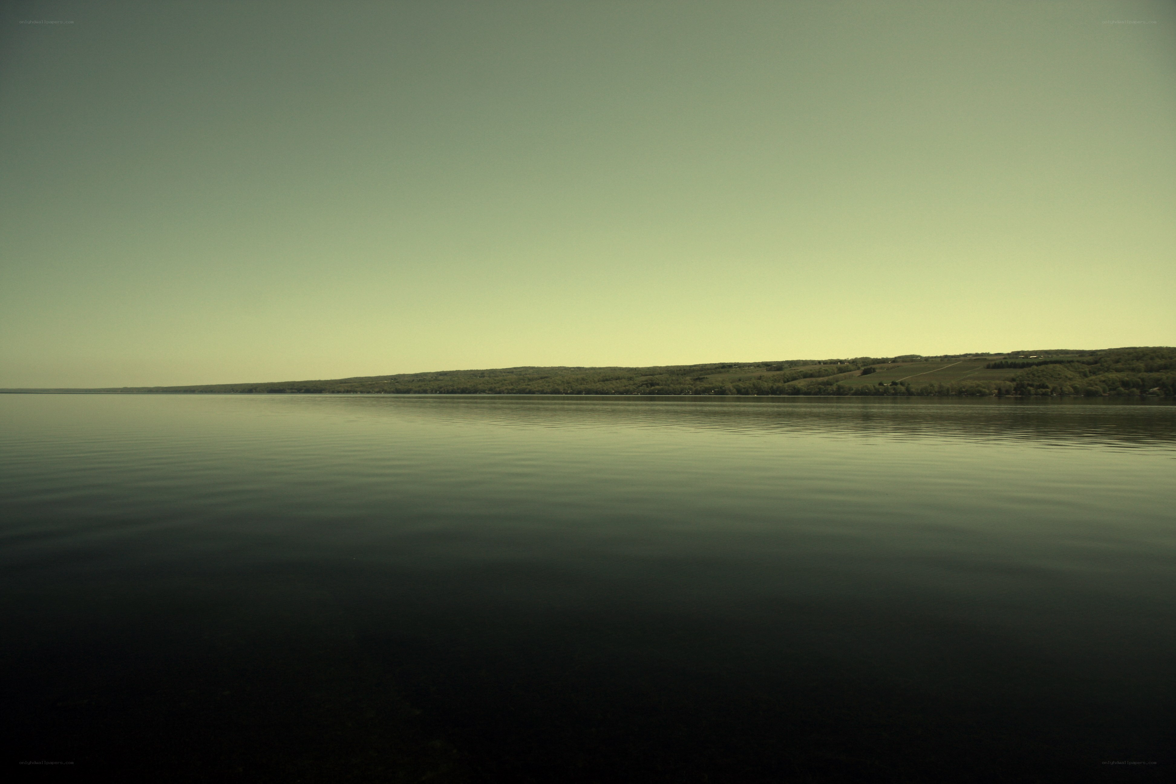 calm lake with distant hills