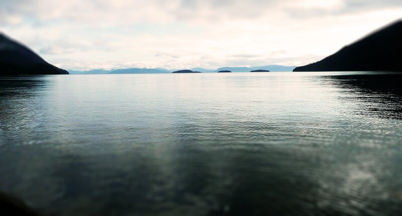 calm lake with distant islands