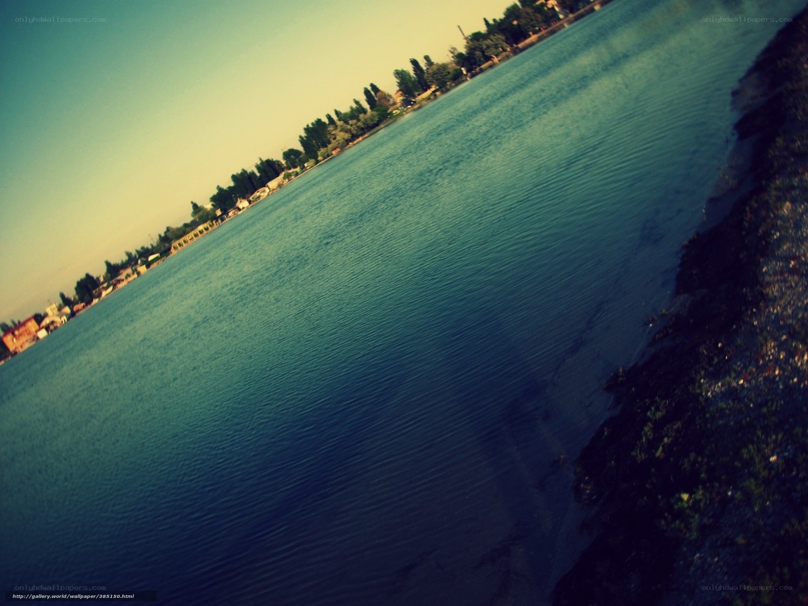calm lake with distant shoreline