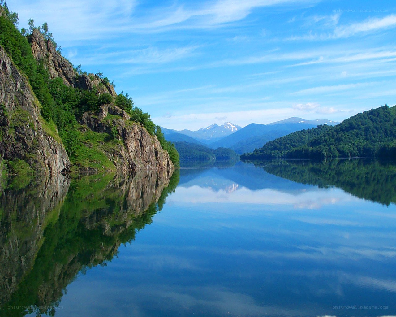 Calm lake with mountain reflection