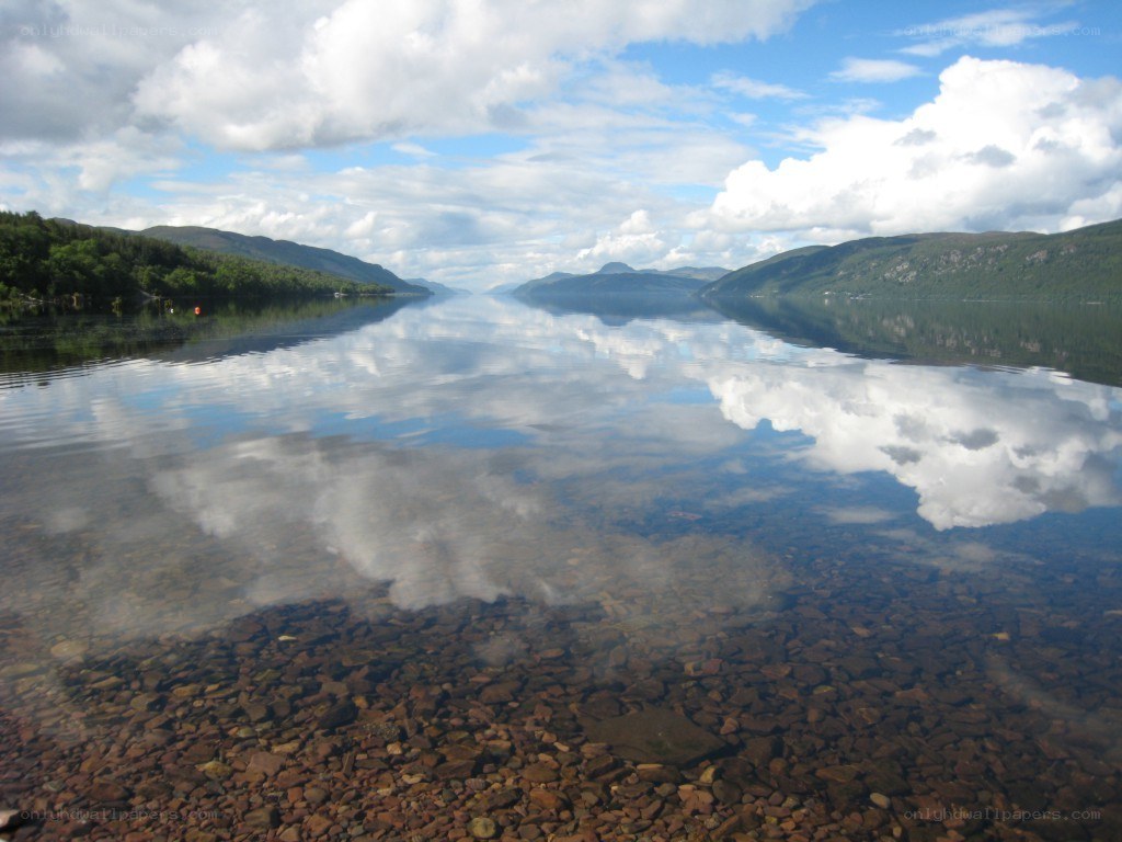 calm lake with mountain reflections