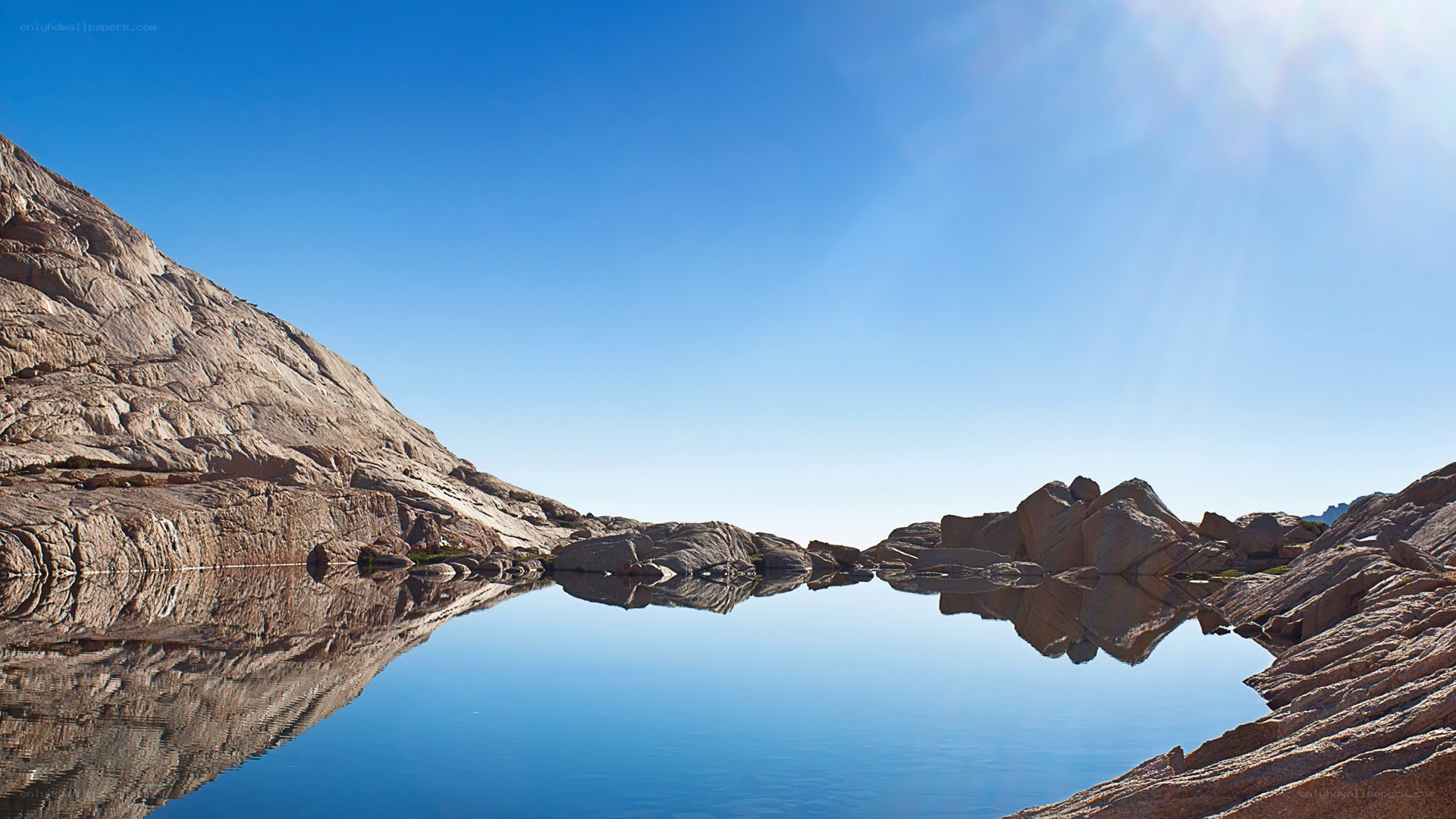 calm lake with mountain reflections