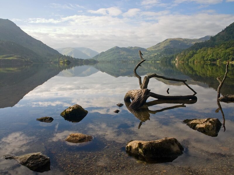 Calm lake with mountain reflections
