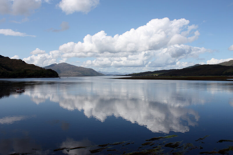 Calm Lake with Mountains — Blue, Serene, Afternoon, Photograph, Clouds, Boat