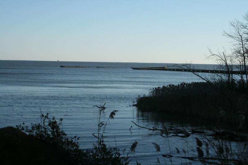 calm lake with pier at dusk