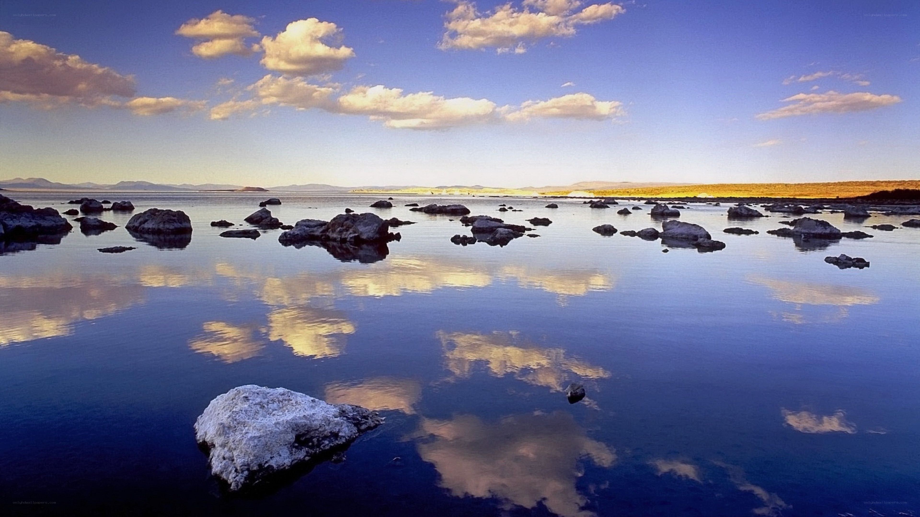 calm lake with rock formations