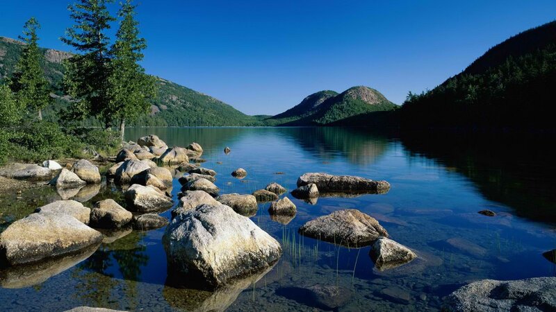 Calm lake with rocky shore
