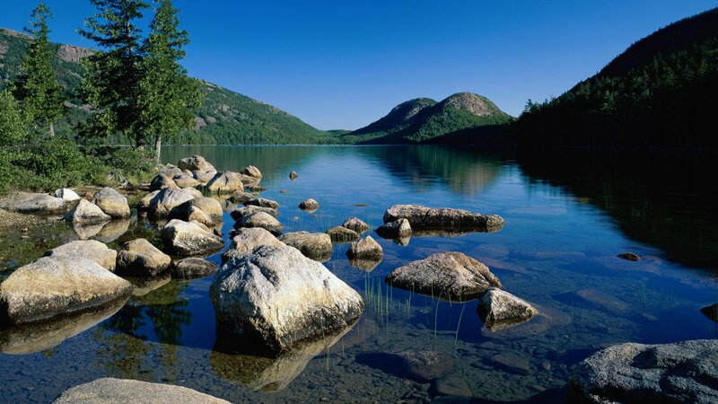 Calm lake with rocky shore