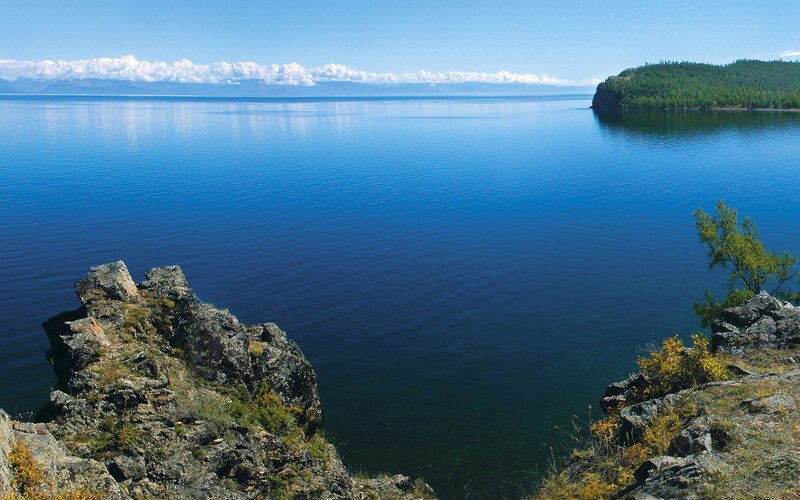 Calm lake with rocky shore