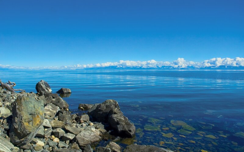 Calm lake with rocky shore