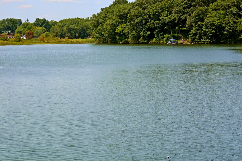 Calm Lake with Trees — Green, Serene, Afternoon, Photograph, Boat