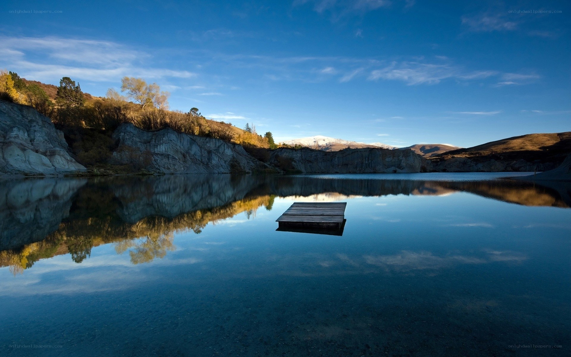 Calm lake with wooden dock