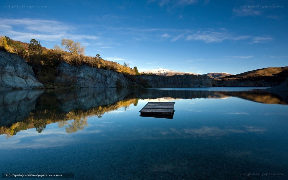 Calm lake with wooden dock