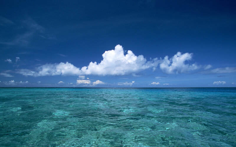 Calm ocean under blue sky