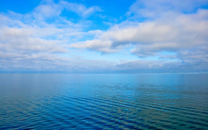 Calm Ocean under Cloudy Sky — Blue