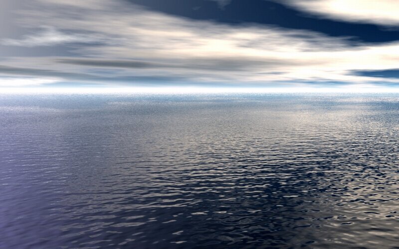 calm ocean under cloudy sky