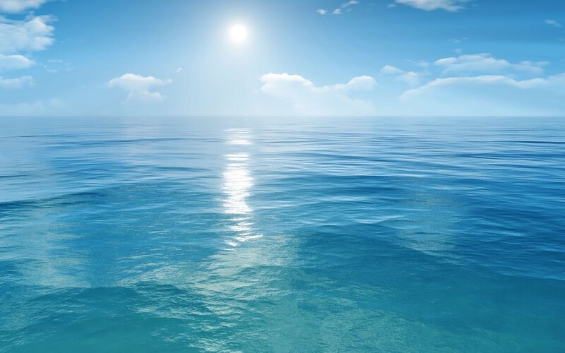 calm ocean under sunny sky