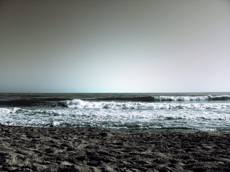 calm ocean waves at dusk