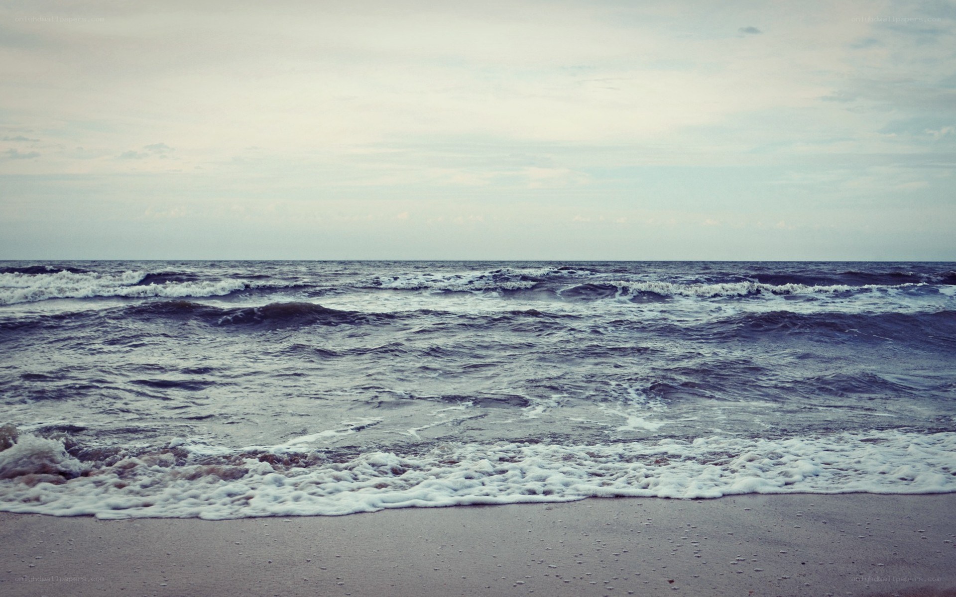 calm ocean waves at dusk