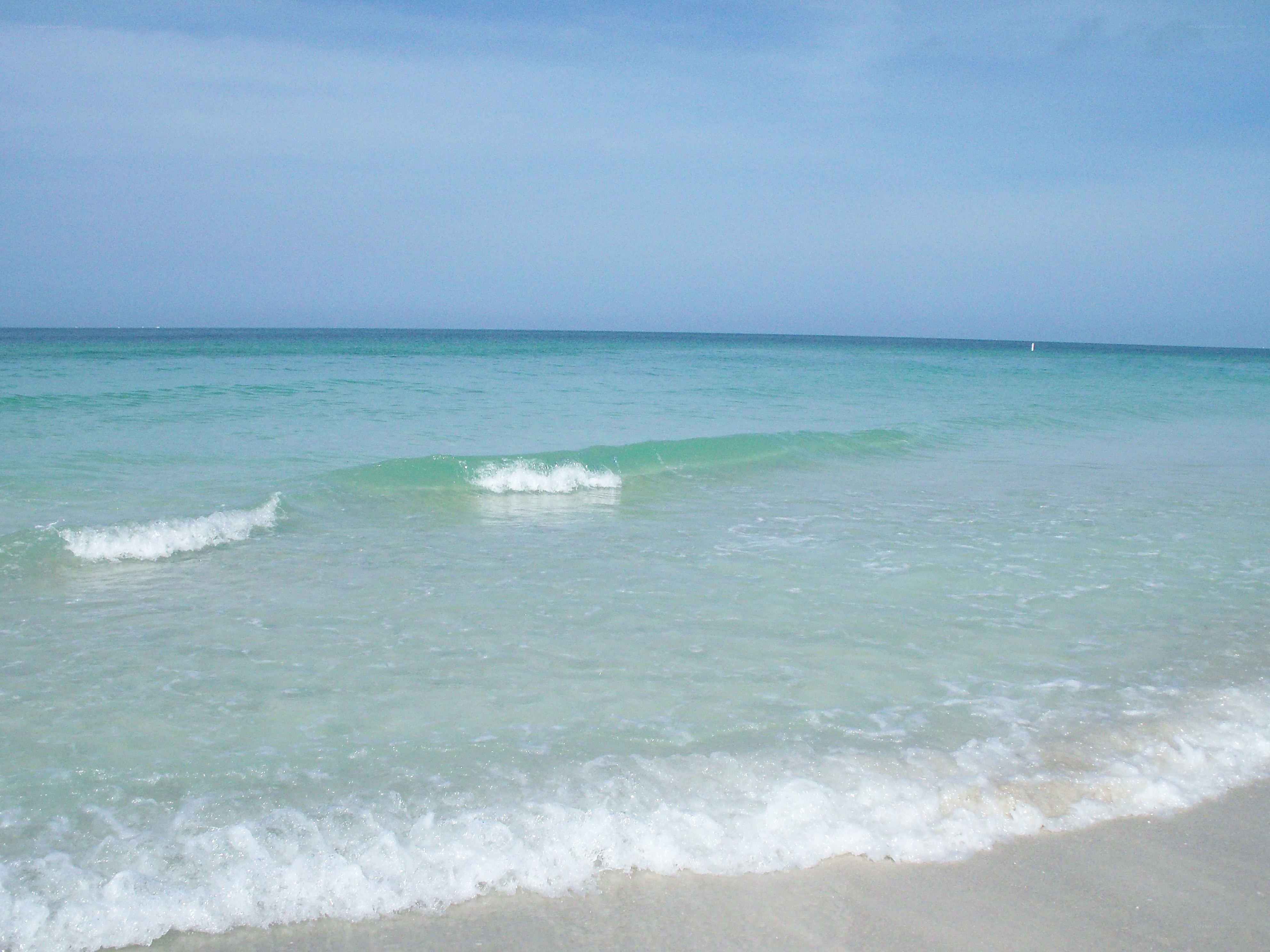 Calm ocean waves on a sunny day