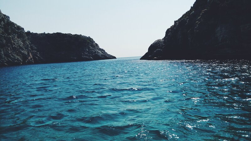 Calm Sea Between Cliffs