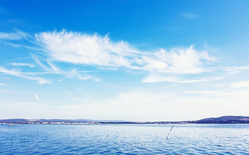 Calm Sea under Blue Sky — Serene