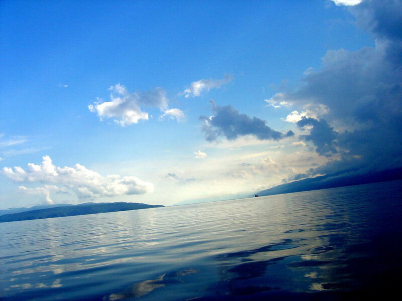 calm sea under blue sky