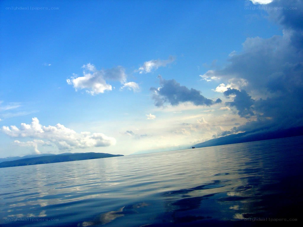 calm sea under blue sky