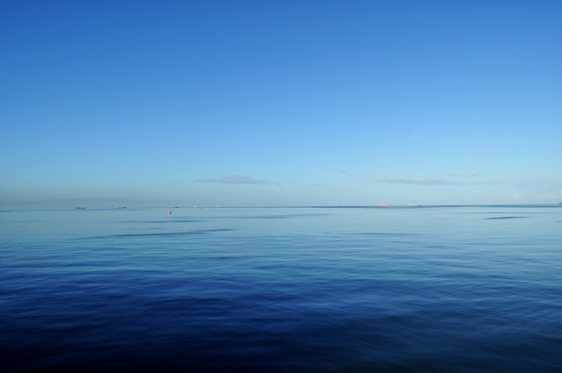 calm sea under clear sky