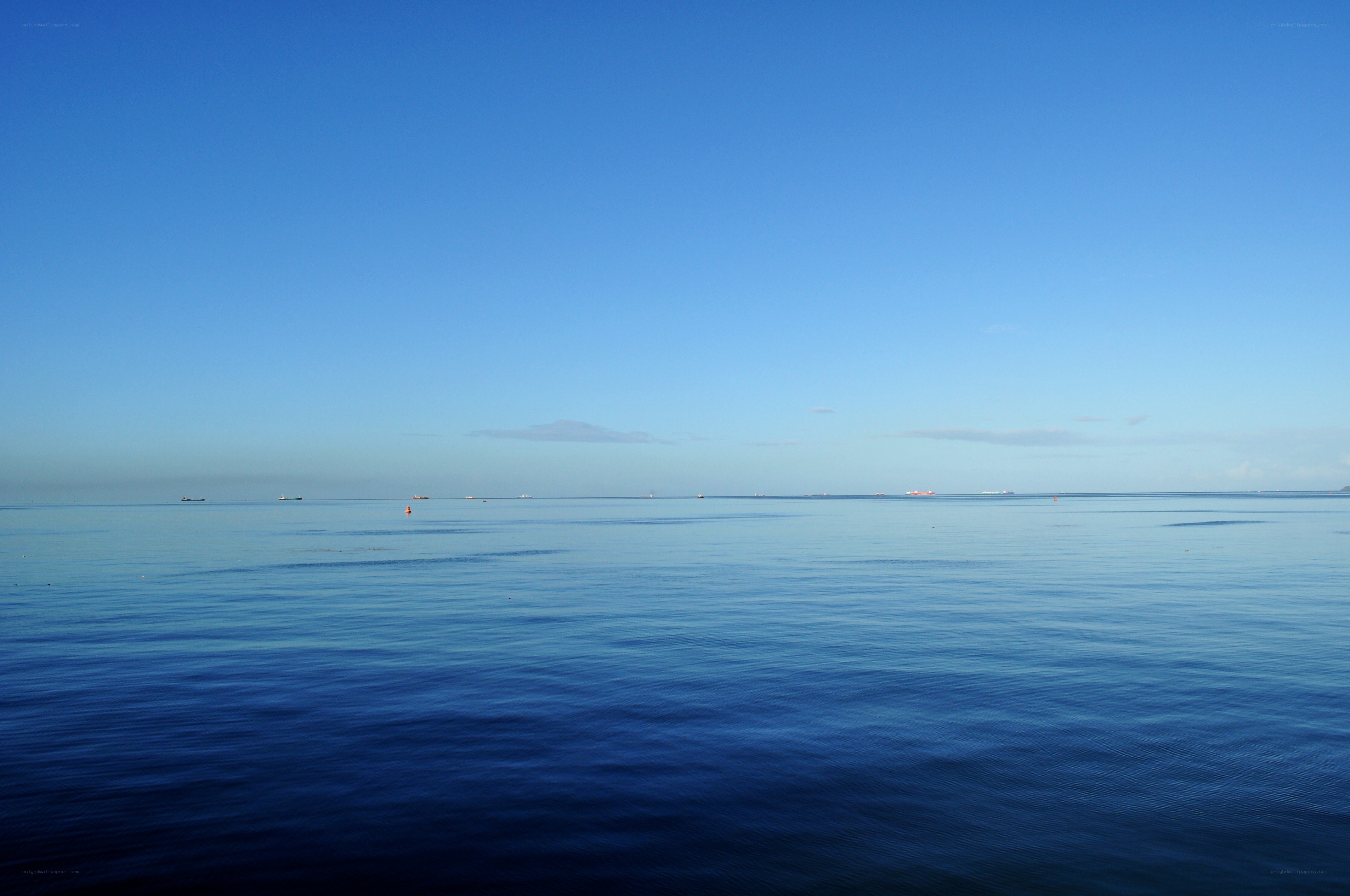 calm sea under clear sky