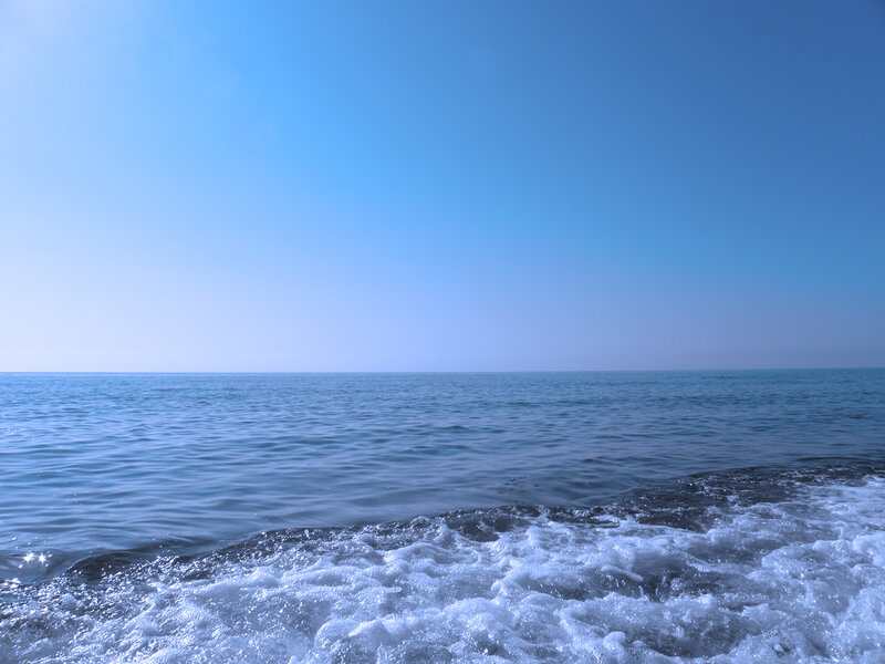 calm sea under clear sky