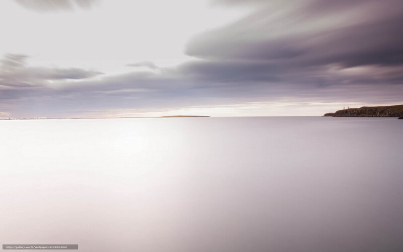 calm sea under cloudy sky