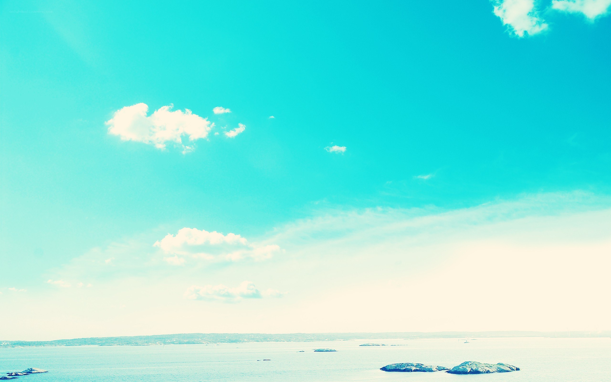 calm sea under turquoise sky