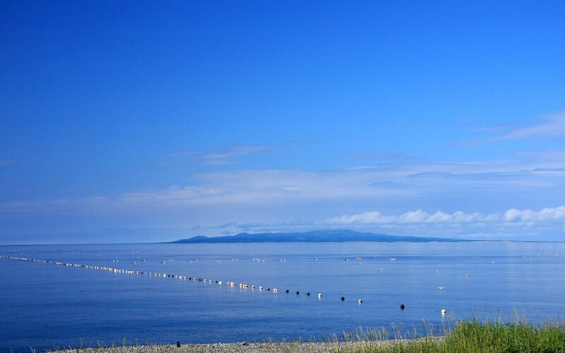 calm sea with distant island