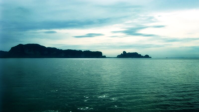calm sea with distant islands