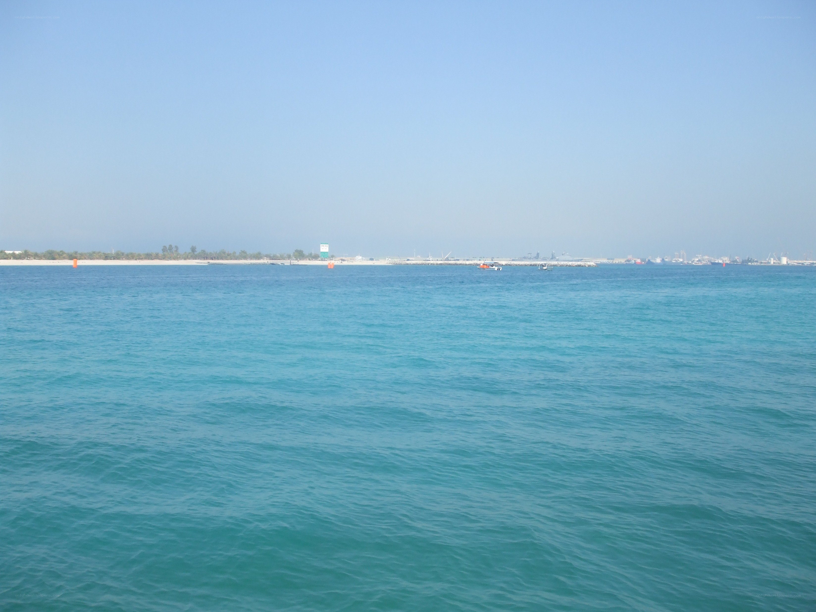 calm sea with distant shore