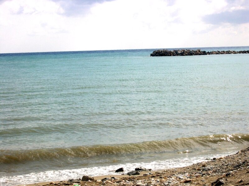 calm sea with rocky jetty