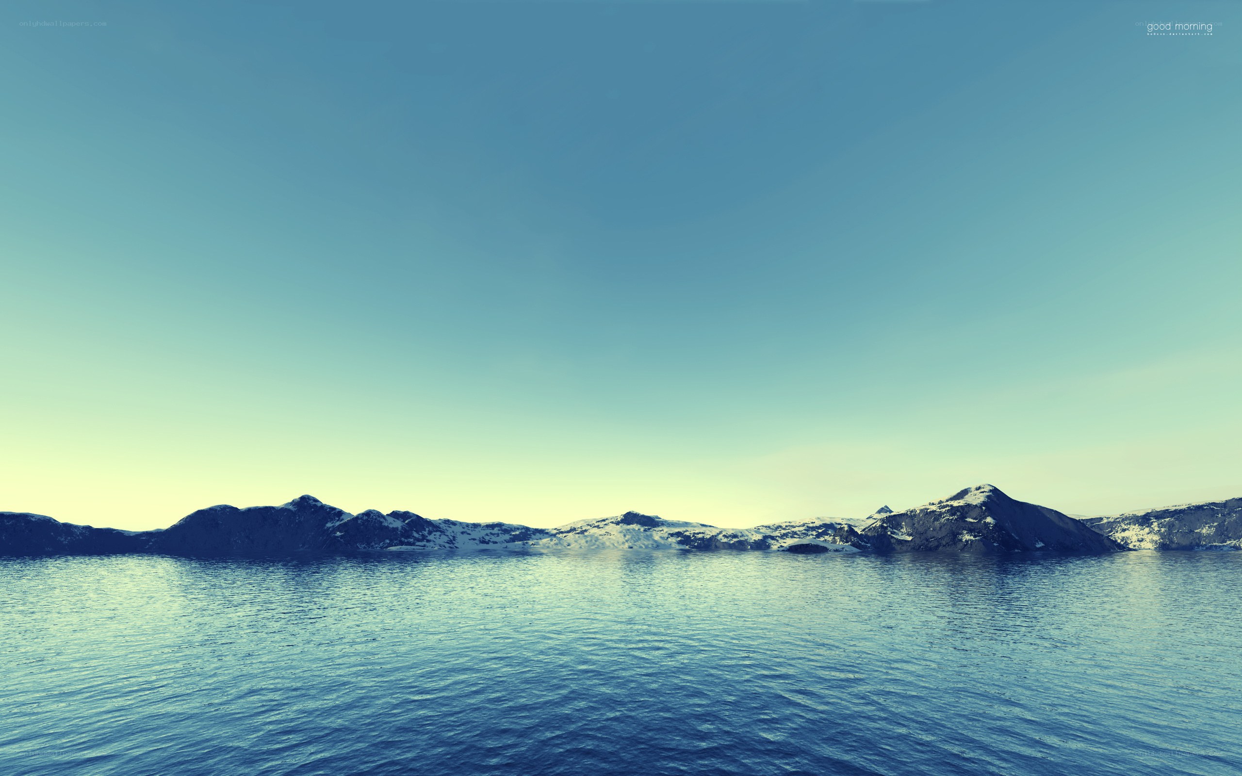 calm sea with snowy mountains