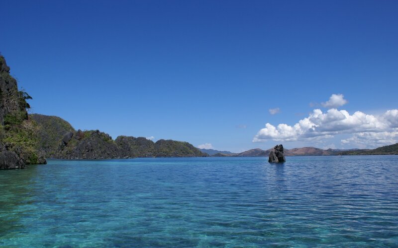Calm tropical bay with rocky islands
